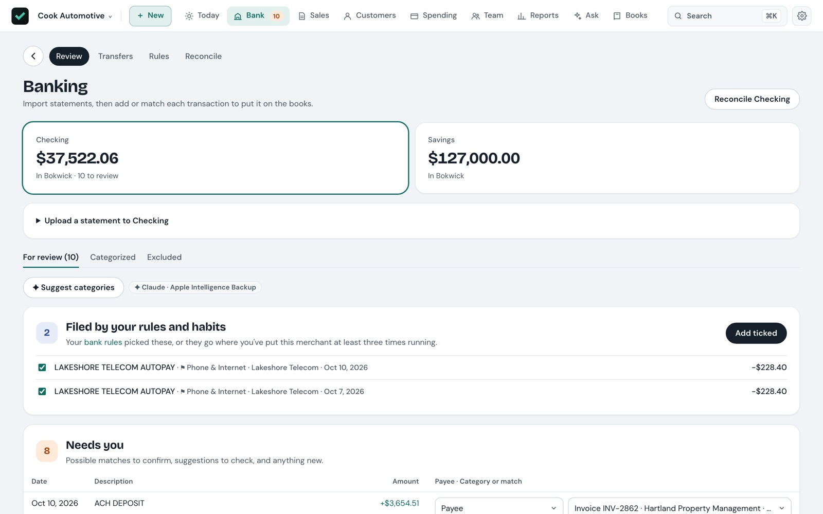 The Banking page: checking and savings balances, two lines filed by bank rules ready to add in one click, and eight that need a decision.